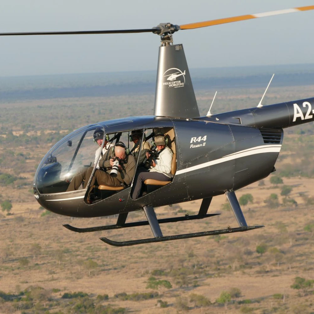 James photographing from a helicopter